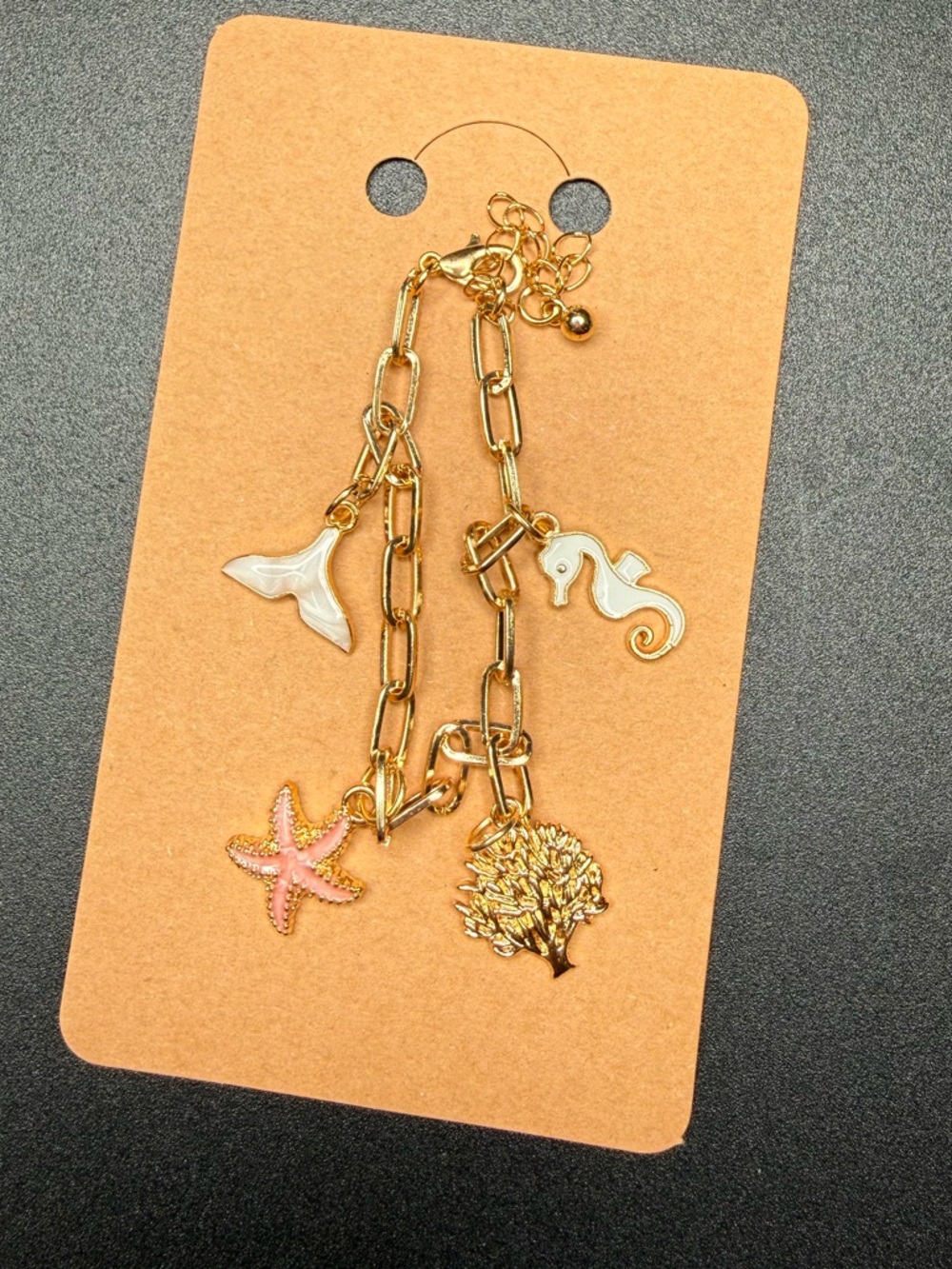 Ocean themed gold tone charm bracelet